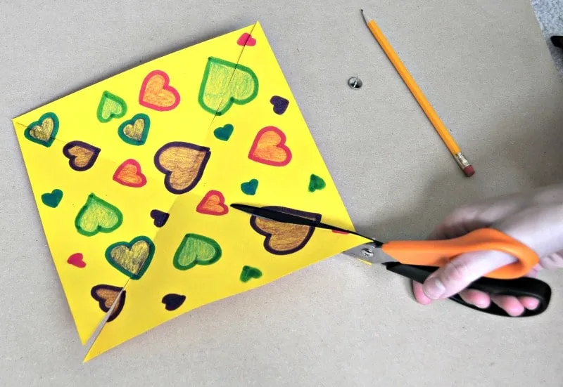 Pinwheel craft with paper and scissors