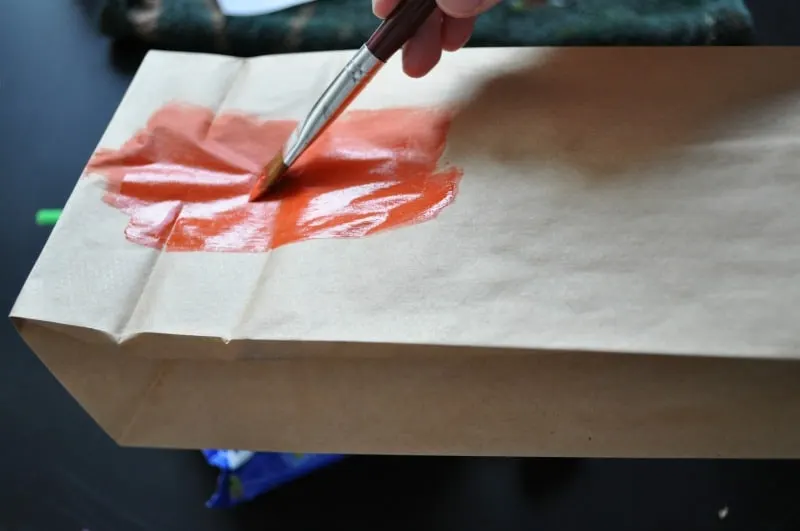 Painting the paper bag orange