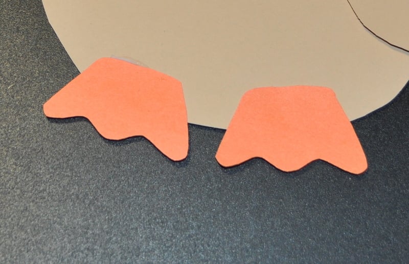 Cut turkey feet out of orange construction paper