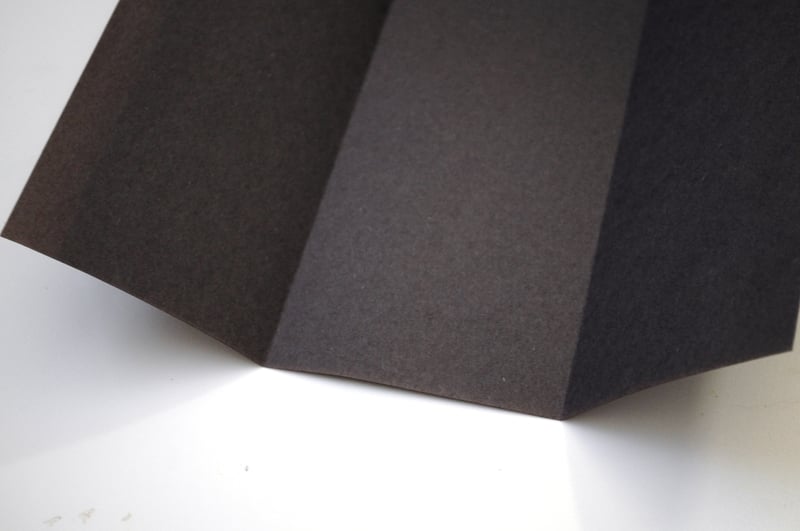 Fold construction paper in three