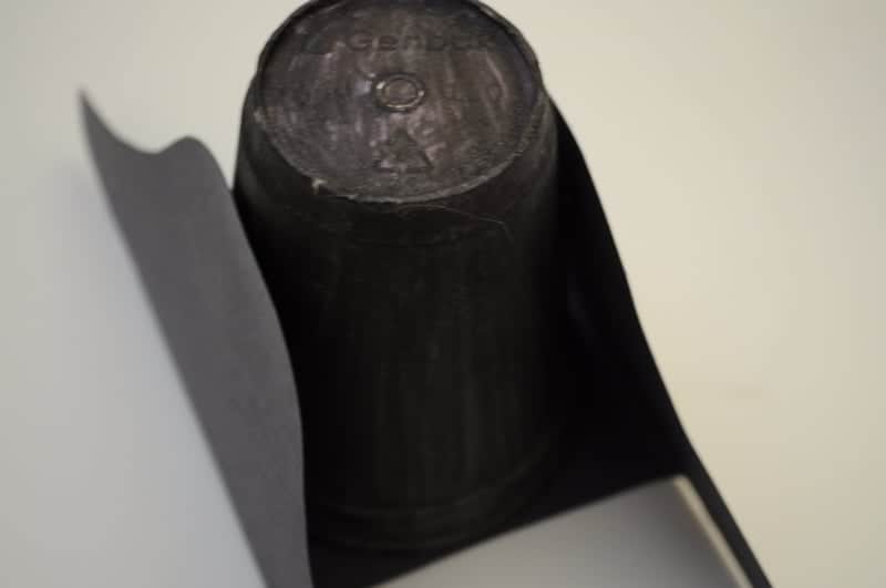 Glue paper flaps to cup and let it dry