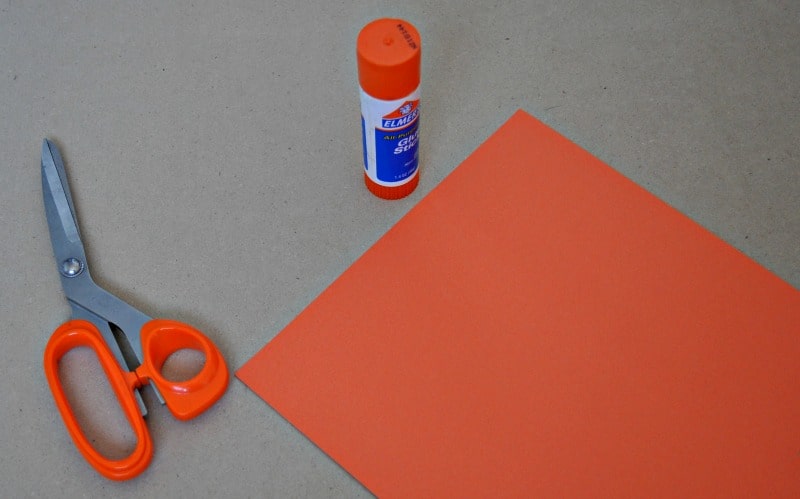 Supplies for making a paper pumpkin for Thanksgiving