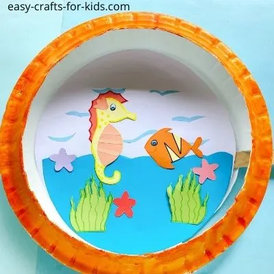 aquatic paper plate craft with seahorse and fish