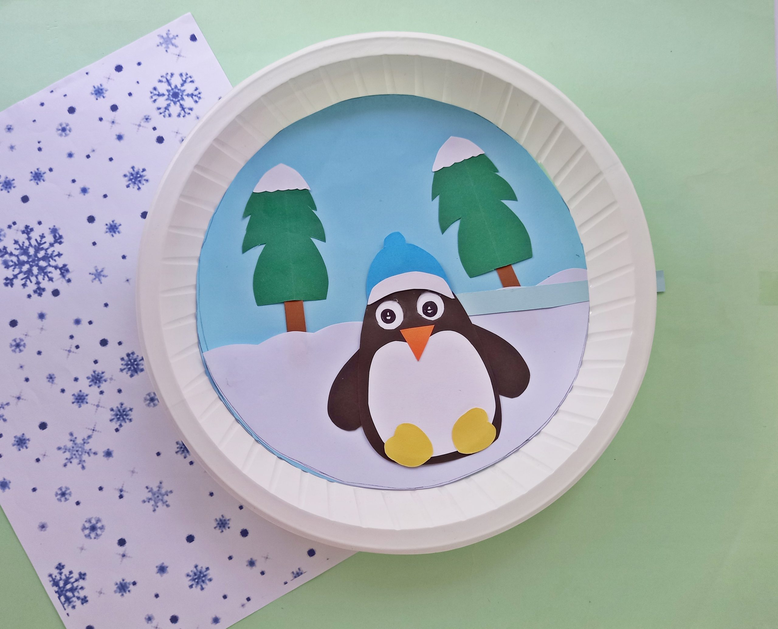 moving eyes penguin paper plate craft