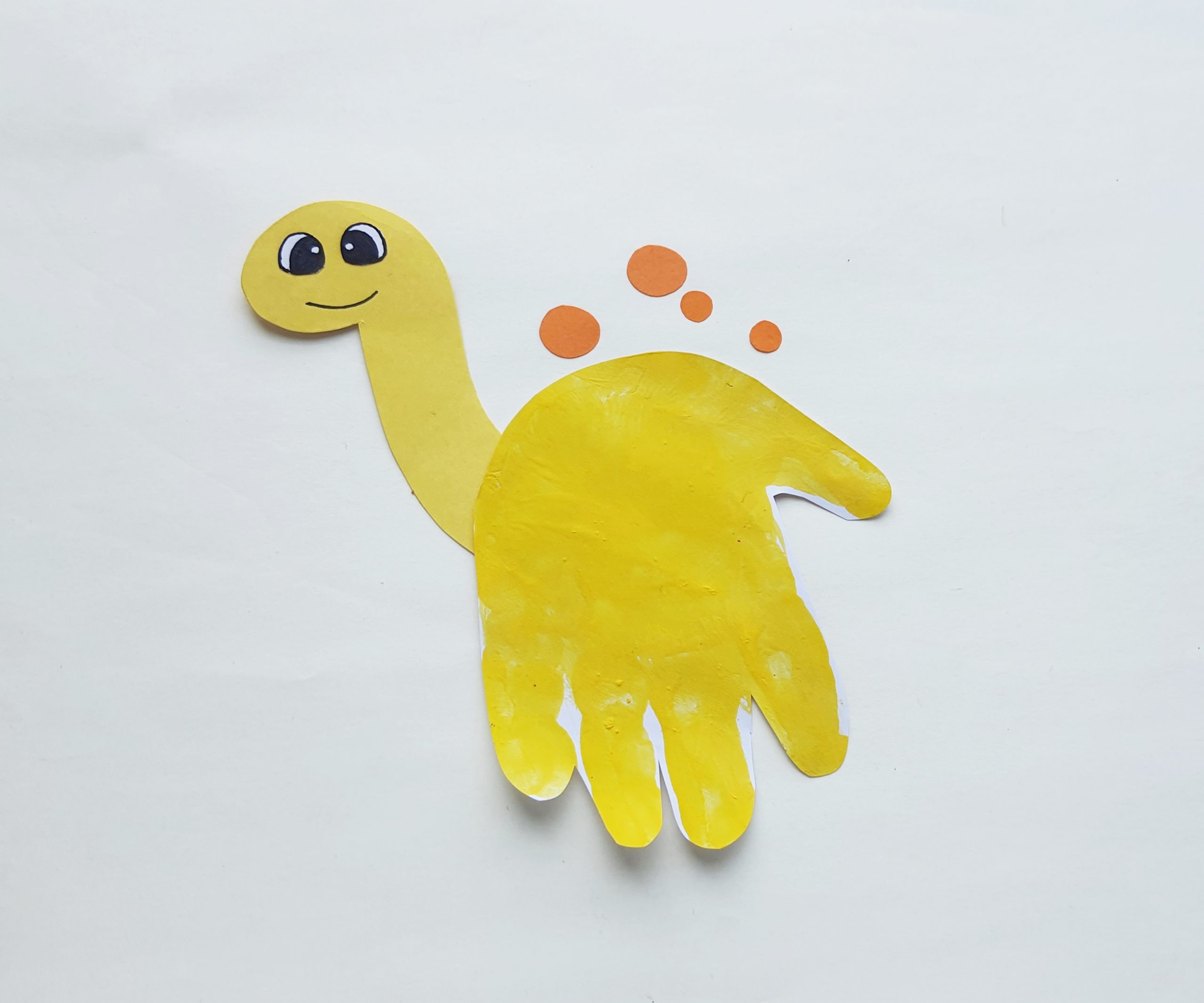 how to make a dinosaur reptile handprint painting